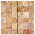 Forum Terra Autumn Leaves (Scabos) travertine 2x2 mosaic sheet honed, studio image showing sun-baked creams, tans, and deeper earthy accents with natural pores and rich variation across the mounted grid for shower floors and warm accent areas.