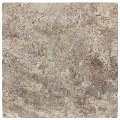 Forum Terra Grigio silver travertine tile 12x12 filled and honed, studio image showing cool gray tones with a smoother filled surface, subtle pore character, and natural variation for modern floors, showers, and clean-lined interiors.