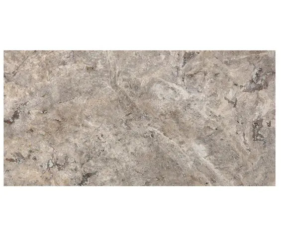 Forum Terra Grigio silver travertine tile 12x24 filled and honed, studio image showing cool gray tones with a smoother filled surface, subtle pore character, and natural variation for modern floors, showers, and clean-lined interiors.
