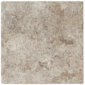 Forum Terra Grigio silver travertine tile 18x18 tumbled, studio image showing cool gray tones with natural pores, softened edges, and subtle variation for modern floors, entryways, and spa-style bathrooms.