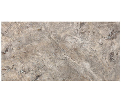 Forum Terra Grigio silver travertine subway tile 3x6 filled and honed, studio image showing cool gray tones with a smoother filled surface, subtle pore character, and natural variation for modern backsplashes, shower walls, and clean-lined interiors.