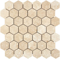 Forum Terra Ivory travertine 2-inch hexagon mosaic sheet honed, studio image showing warm ivory-beige tones with natural pores and quiet variation for shower floors and spa-style accents.