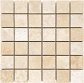 Forum Terra Ivory travertine 2x2 mosaic sheet honed, studio image showing warm ivory-beige tones with natural pores and quiet variation in a clean grid for shower floors and wet-area accents.