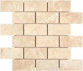 Forum Terra Ivory travertine 2x4 brick mosaic sheet honed, studio image showing warm ivory-beige tones with natural pores and quiet variation in a clean running-bond pattern for shower floors and accents.