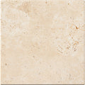 Forum Terra Ivory travertine tile 12x12 tumbled antiqued, studio image showing warm ivory-beige tone with natural pores, softened edges, and quiet variation for relaxed floors, showers, and timeless interiors.