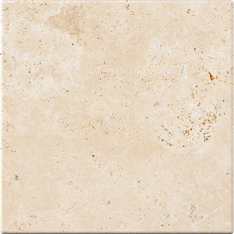Forum Terra Ivory travertine tile 12x12 tumbled antiqued, studio image showing warm ivory-beige tone with natural pores, softened edges, and quiet variation for relaxed floors, showers, and timeless interiors.