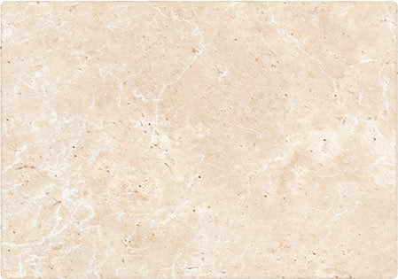 Forum Terra Ivory travertine tile 16x24 tumbled antiqued, studio image showing warm ivory-beige tone with natural pores, softened edges, and quiet variation for relaxed floors, entryways, and timeless interiors.