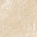 Forum Terra Ivory travertine tile 18x18 honed, studio image showing warm ivory-beige tone with natural pores and quiet variation for relaxed floors, entryways, and spa-style bathrooms.
