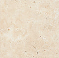 Forum Terra Ivory travertine tile 18x18 tumbled antiqued, studio image showing warm ivory-beige tone with natural pores, softened edges, and quiet variation for relaxed floors and timeless interiors.