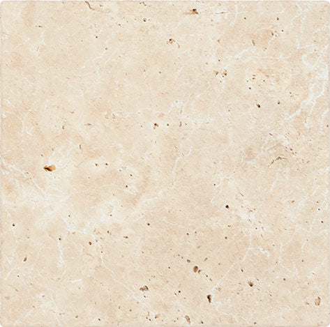 Forum Terra Ivory travertine tile 18x18 tumbled antiqued, studio image showing warm ivory-beige tone with natural pores, softened edges, and quiet variation for relaxed floors and timeless interiors.