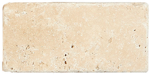 Forum Terra Ivory travertine subway tile 3x6 tumbled, studio image showing warm ivory-beige tone with natural pores, softened edges, and quiet variation for rustic backsplashes, shower walls, and timeless accents.