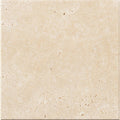 Forum Terra Ivory travertine tile 4x4 tumbled, studio image showing warm ivory-beige tone with natural pores, softened edges, and quiet variation for rustic backsplashes, shower walls, and timeless accents.