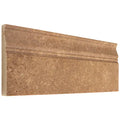 Forum Terra Umber travertine baseboard trim, studio image showing a molded rich brown profile with natural pores and subtle variation for grounded wall-to-floor transitions.