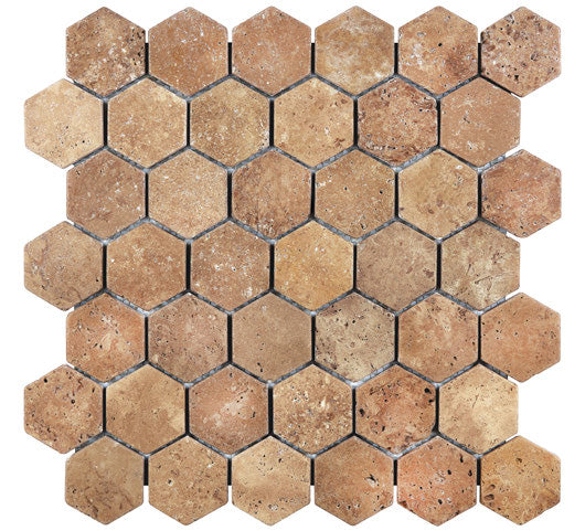 Forum Terra Umber travertine 2-inch hexagon mosaic sheet tumbled, studio image showing rich warm brown tones with natural pores, softened edges, and subtle variation for shower floors and wet-area accents.