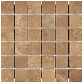 Forum Terra Umber travertine 2x2 mosaic sheet tumbled, studio image showing rich warm brown tones with natural pores and subtle variation in a clean grid for shower floors and wet-area accents.