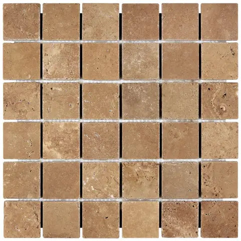 Forum Terra Umber travertine 2x2 mosaic sheet tumbled, studio image showing rich warm brown tones with natural pores and subtle variation in a clean grid for shower floors and wet-area accents.