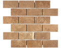 Forum Terra Umber travertine 2x4 brick mosaic sheet tumbled, studio image showing rich warm brown tones with natural pores and subtle variation in a classic running-bond pattern for shower floors and accents.