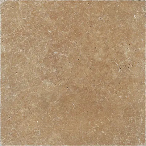 Forum Terra Umber travertine tile 12x12 tumbled, studio image showing rich warm brown tone with natural pores, softened edges, and subtle variation for rustic floors, shower walls, and timeless interiors.
