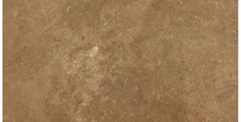 Forum Terra Umber travertine subway tile 3x6 honed and filled, studio image showing rich warm brown tone with a smoother filled surface, subtle pore character, and natural variation for backsplashes, shower walls, and classic accents.