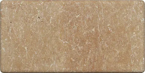 Forum Terra Umber travertine subway tile 3x6 tumbled, studio image showing rich warm brown tone with natural pores, softened edges, and subtle variation for rustic backsplashes, shower walls, and timeless accents.