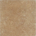 Forum Terra Umber travertine tile 6x6 tumbled, studio image showing rich warm brown tone with natural pores, softened edges, and subtle variation for rustic backsplashes, shower walls, and timeless accents.