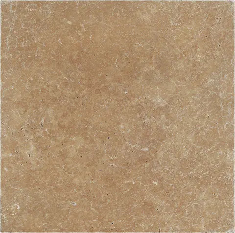 Forum Terra Umber travertine tile 6x6 tumbled, studio image showing rich warm brown tone with natural pores, softened edges, and subtle variation for rustic backsplashes, shower walls, and timeless accents.