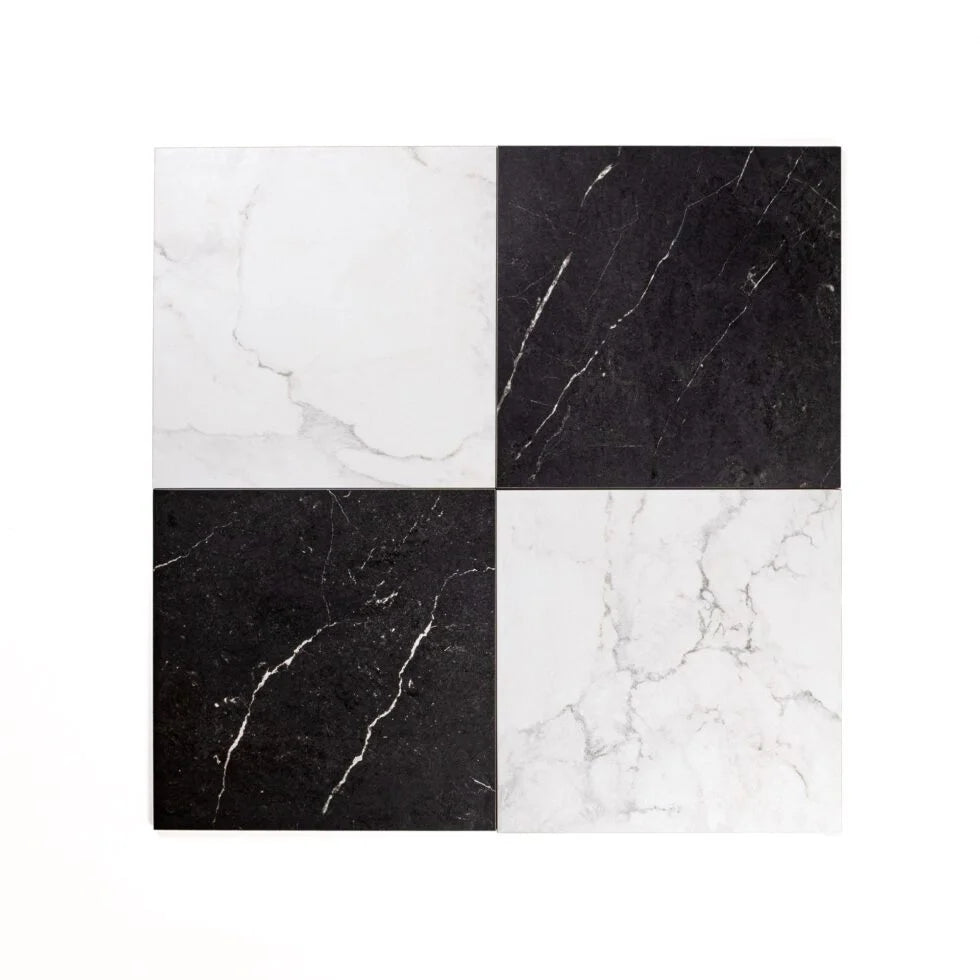 Four square tiles with black and white marble pattern on a white background