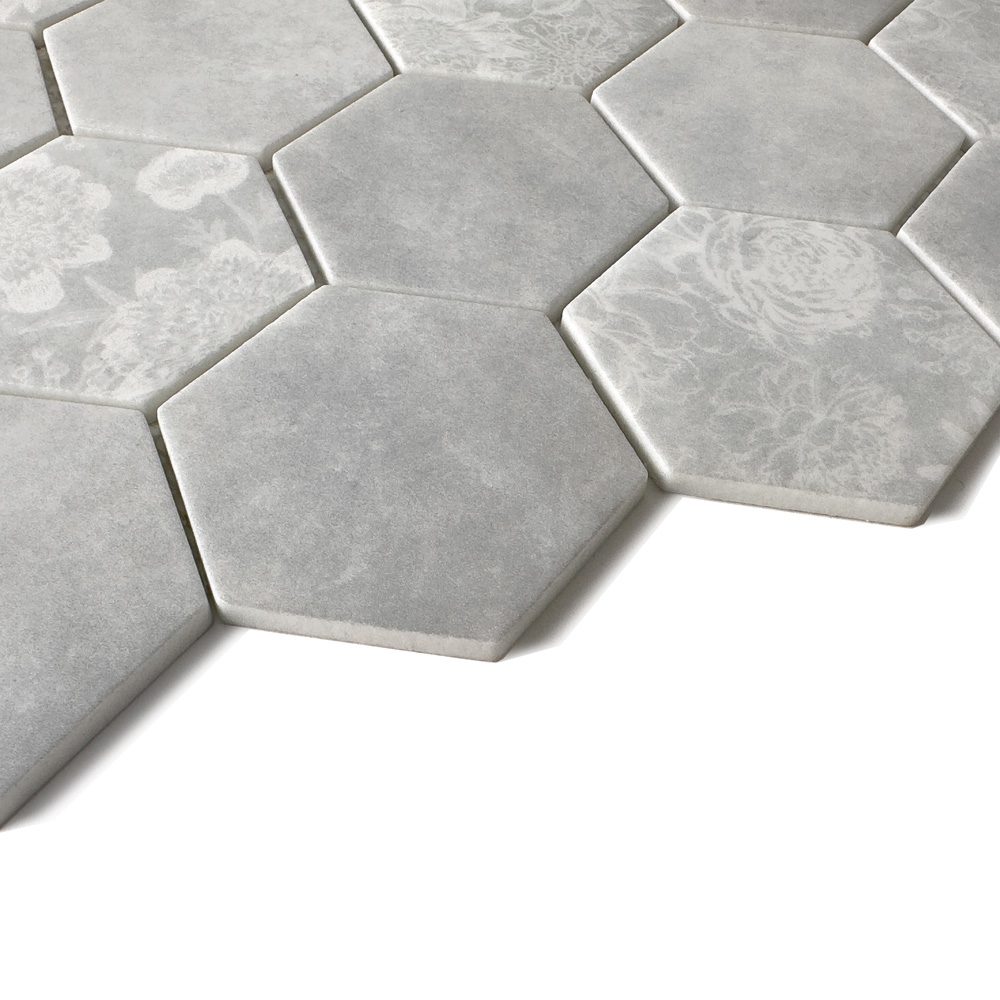 Close-up of HexaFusion Botanica Ivy Vale matte pressed glass 3 inch hexagon mosaic with floral pattern
