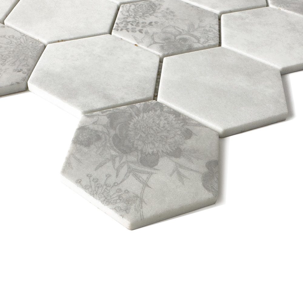Close-up of HexaFusion Botanica Linden Bloom matte pressed glass 3 inch hexagon mosaic with floral pattern