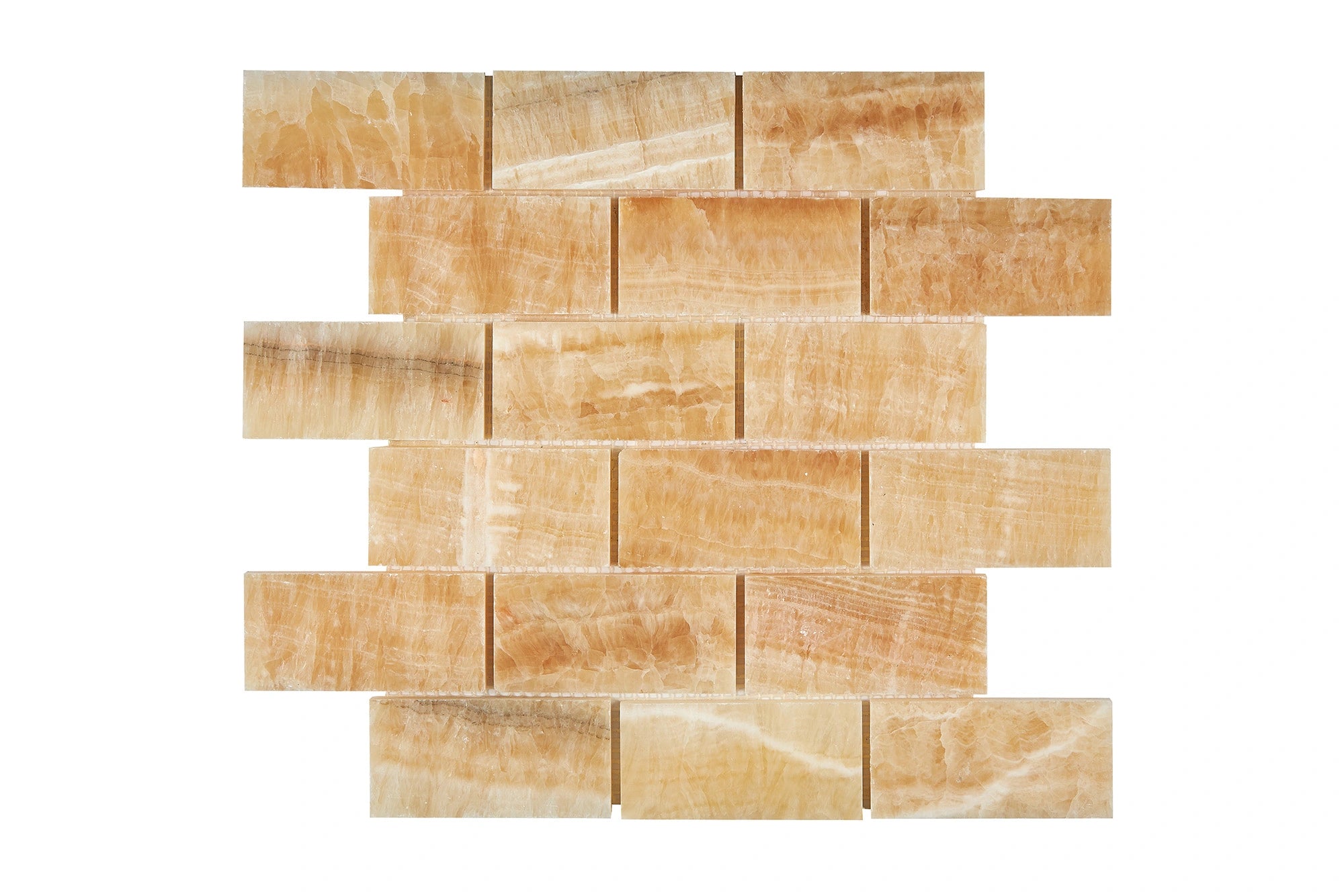 Opalus Honey onyx mosaic 2x4 polished, studio image showing warm honey-gold tones, layered movement, and natural translucency across the mounted sheet.