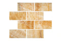 Opalus Honey onyx tile 3x6 polished, studio image showing warm honey-gold tones, layered movement, and natural translucency with face-to-face variation.