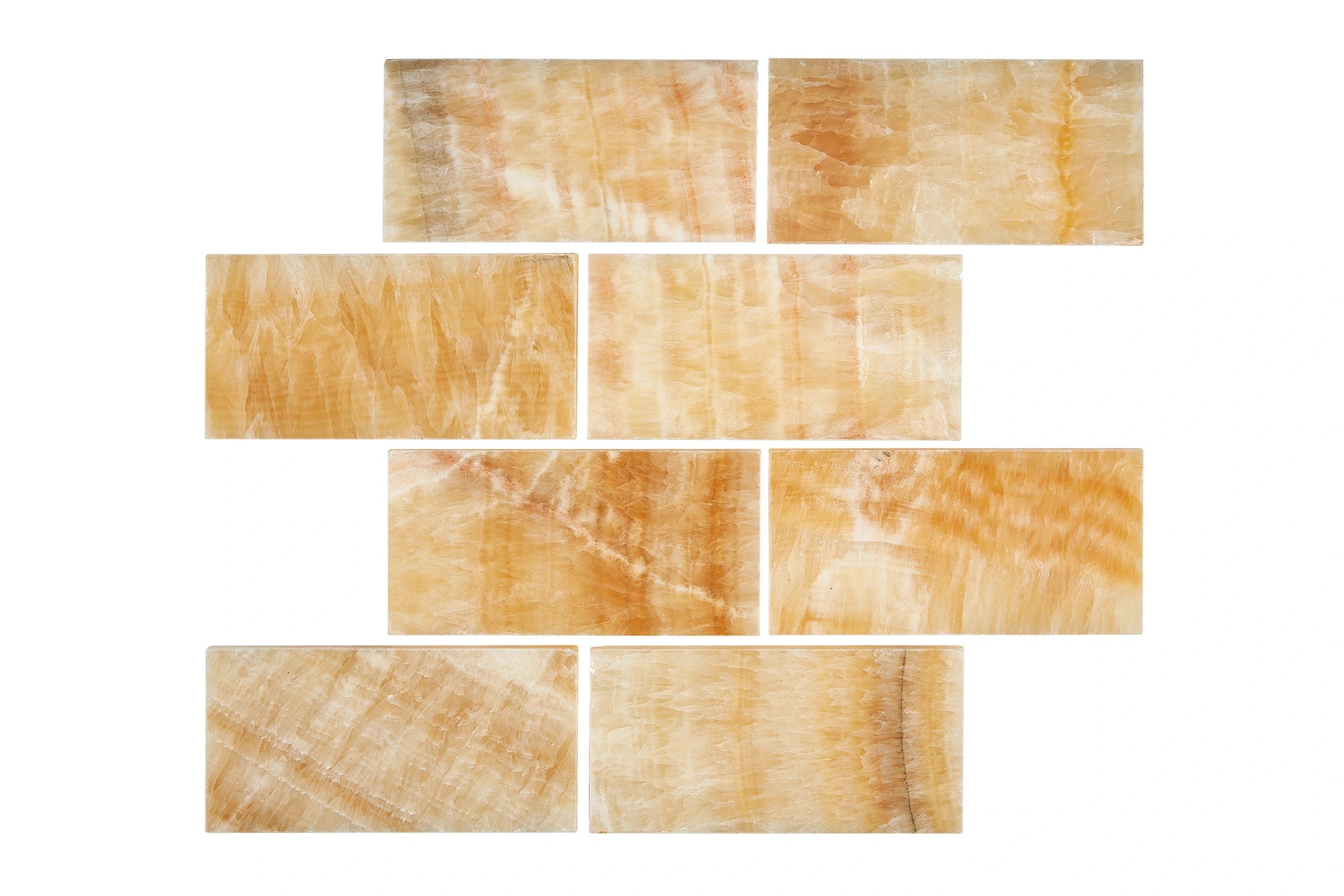 Opalus Honey onyx tile 3x6 polished, studio image showing warm honey-gold tones, layered movement, and natural translucency with face-to-face variation.