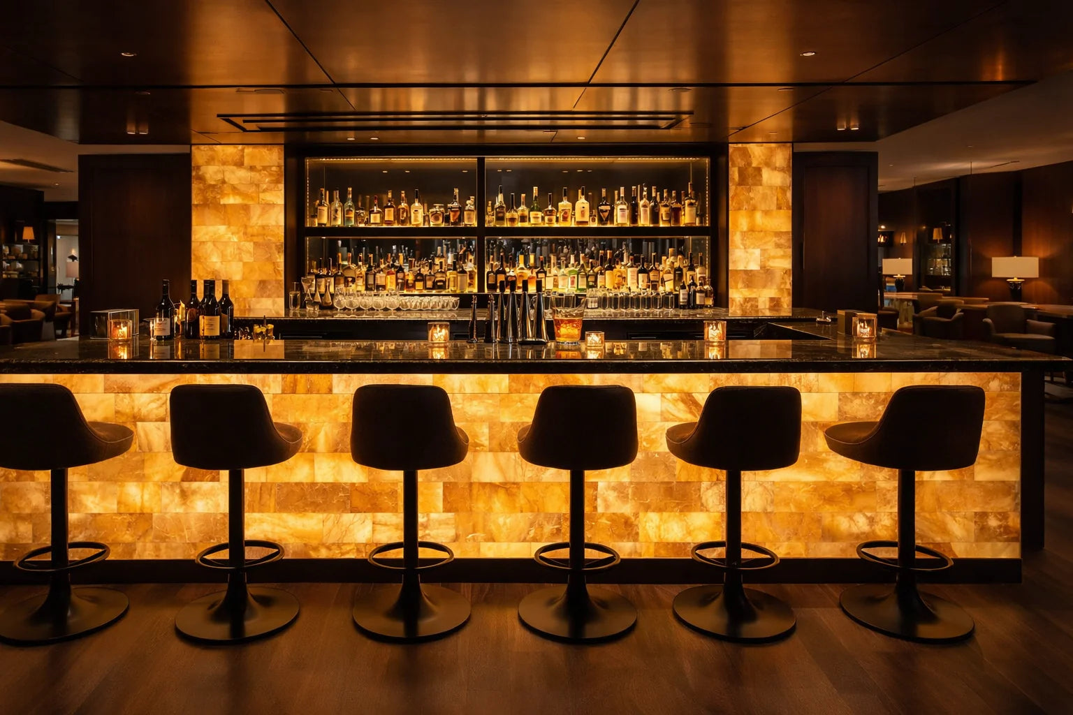 Bar counter with stools in a dimly lit bar setting