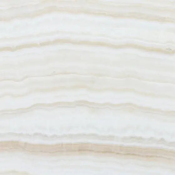 Opalus Vanilla onyx tile 12x12 vein-cut, studio image showing creamy ivory tones with soft, cloud-like banding and natural translucency variation.