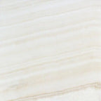 Opalus Vanilla onyx tile 18x18 cross-cut, studio image showing creamy ivory tones with soft cloud-like movement, natural translucency, and subtle tonal variation.