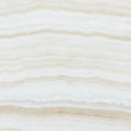 Opalus Vanilla onyx tile 18x18 vein-cut, studio image showing linear ivory banding, layered translucent depth, and natural veining variation from piece to piece.