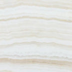 Opalus Vanilla onyx tile 18x18 vein-cut, studio image showing linear ivory banding, layered translucent depth, and natural veining variation from piece to piece.