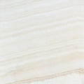 Opalus Vanilla onyx tile 4x4 cross-cut, studio image showing creamy ivory tones with soft cloud-like movement, natural translucency, and gentle tonal variation.