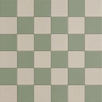 Close-up of sage and sand checkerboard porcelain tiles with subtle plaster-look texture, matte finish