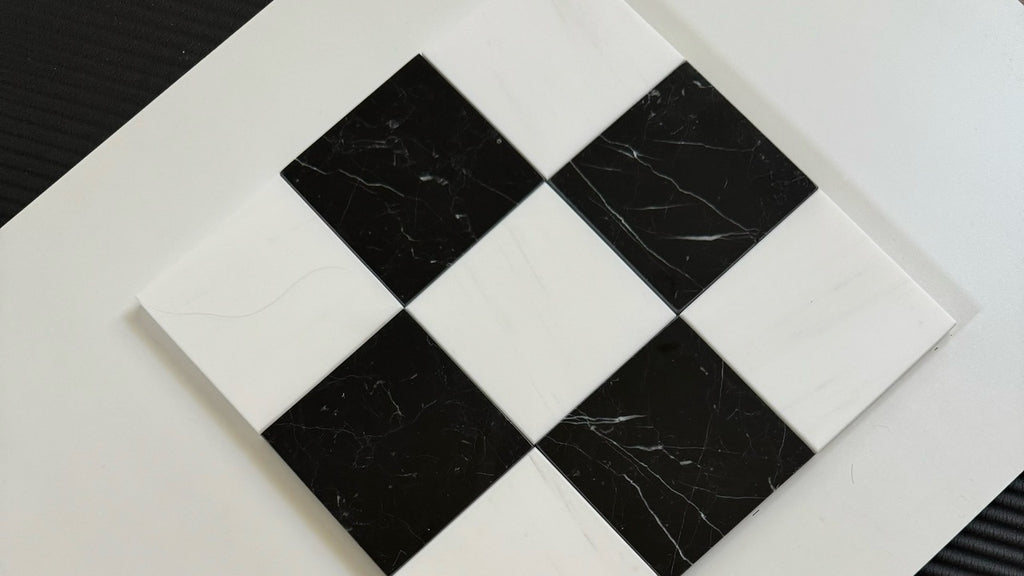Black and white checkered tile with visible wear on a white background