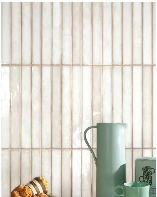 Pearl Wash Spanish Brick ceramic mosaic, 14×14 matte — installed vertical brick mosaic on wall in a bright kitchen setting