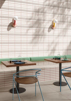Porcelain Cream Tempo tile wall installation in a hospitality seating area.