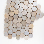 Close-up of Kasbah Mauve glossy zellige circles mosaic showing glaze movement and hand-formed edges
