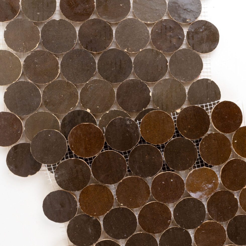 ArtePierre Zellige Atelier Circles glossy zellige mosaic sheets in Espresso Noire (Brown), stacked studio image highlighting handmade surface depth, glaze variation, and subtle edge irregularity for backsplashes and shower walls.