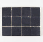 Indigo Bazaar glossy zellige 4x4 tile panel showing a bold square-grid look with handmade variation.