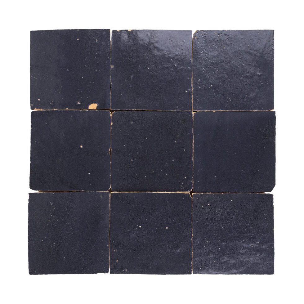 Indigo Bazaar zellige tile 4x4 in glossy finish, handmade square tiles with subtle glaze variation (studio view).