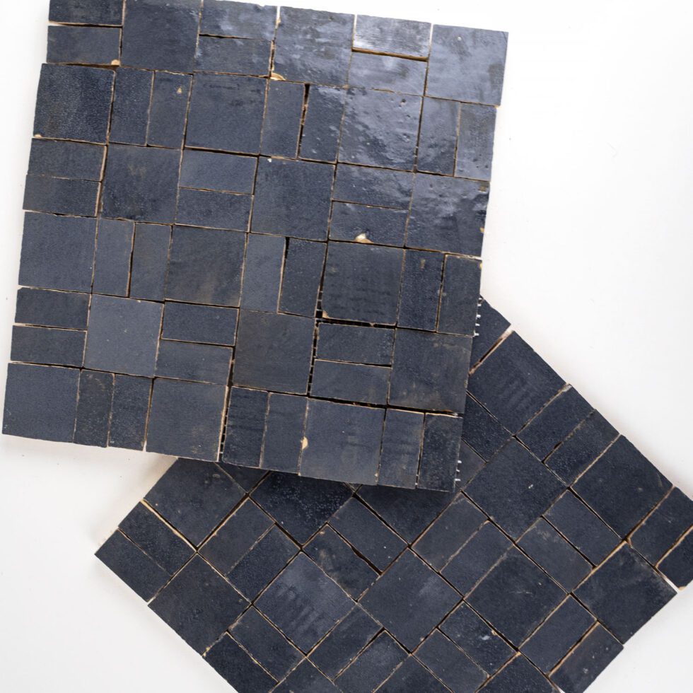 ArtePierre Zellige Atelier Lattice mosaic sheets in Atlas Indigo (Navy), glossy handmade zellige terracotta highlighting surface depth, glaze variation, and hand-cut edges for backsplashes and shower walls.