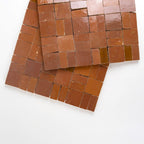 ArtePierre Zellige Atelier Lattice mosaic sheets in Sunbaked Terracotta, glossy handmade zellige terracotta highlighting surface depth, tonal variation, and hand-cut edges for backsplashes and shower walls.