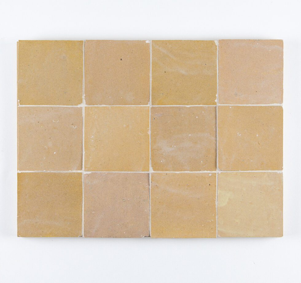 Nomad Veil zellige 4x4 tile panel, glossy sand-beige, handmade variation across the layout