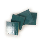 Stacked Blue Medina 4x4 glossy zellige tiles showing hand-cut edges and natural thickness variation.